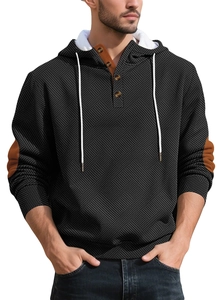 Detail of waffle knit hoodie with button placket and contrasting orange elbow patches