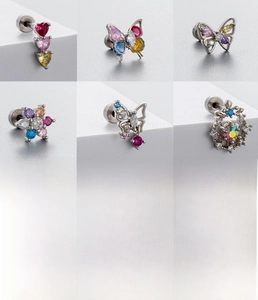Detailed views of titanium steel studs with colorful zirconia butterfly and heart shapes