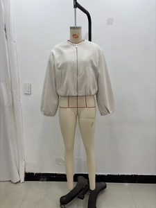 Detail of light grey zippered bomber jacket with drop shoulders and elastic cuffs