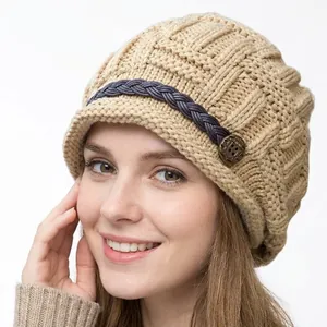 Women's khaki knit beanie hat with braided leather strap and retro bronze button
