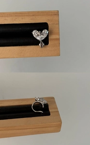 Detailed macro view of high-quality zircon heart cross ear cuff with 18k gold plating