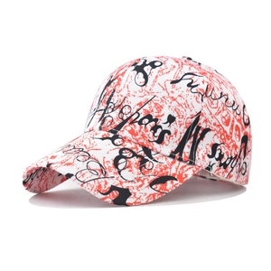 Detailed close-up of a baseball cap with red and white ink splatter texture and black graffiti