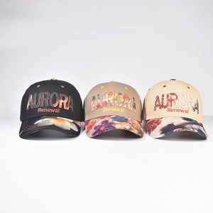 Three embroidered baseball caps in black, khaki, and beige with floral print brims