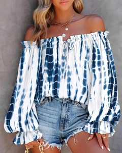 Detail of off-shoulder tie-dye top with drawstring neckline and flared ruffle sleeves