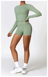 Side view of avocado green long-sleeved yoga top and high-waisted shorts for fitness