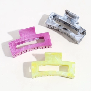 Three-piece set of square hair claws in marble patterns of grey, pink, and yellow finish