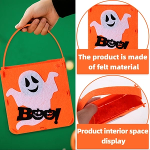 Detail of orange felt Halloween candy bag with white ghost patch and Boo text