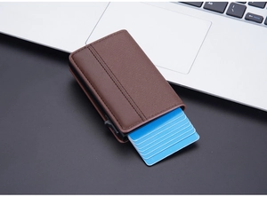 Detail of RFID-blocking brown card holder with cards ejected in tiered mechanism