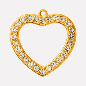 Macro detail of heart-shaped hollow pendant in gold finish with sparkling rhinestones
