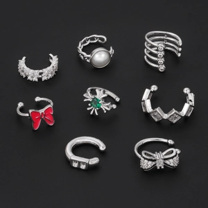 8-piece silver ear cuff set featuring zircon butterfly and geometric bow designs