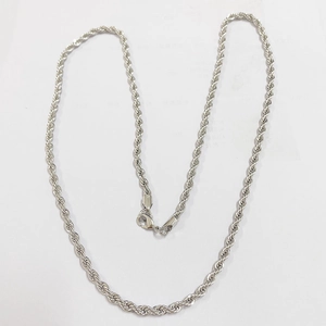Macro shot of silver twisted rope chain necklace featuring a durable lobster clasp