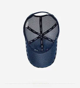 Detail view of the breathable mesh structure and brand tape inside the blue baseball cap