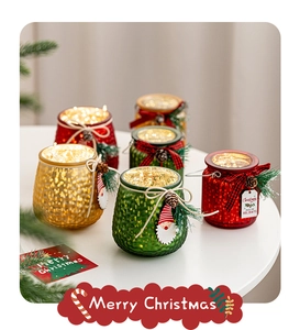 Close-up of Christmas glass LED jar with pinecones and warm festive light decorations