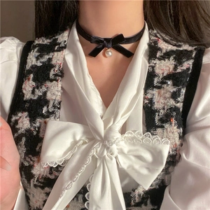 Elegant black velvet choker necklace featuring a bow and pearl pendant for women
