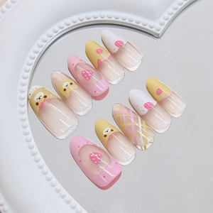Sweet pink and yellow strawberry bear press-on nails in long oval shape with plaid patterns