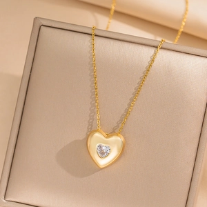 Minimalist gold heart necklace with clear crystal in a gift box for women