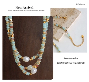Detail of double-layer beaded necklace with blue stones and baroque pearls