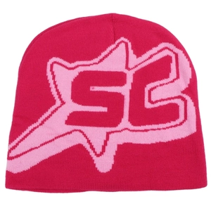Detailed knit texture of a bright pink hip-hop beanie with jacquard SC logo pattern