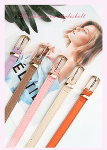 Detail of colorful slim PU leather waist belts for women with elegant golden buckles