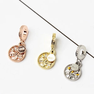 Three S925 sterling silver tree of life pendants in rose gold, gold and silver finishes