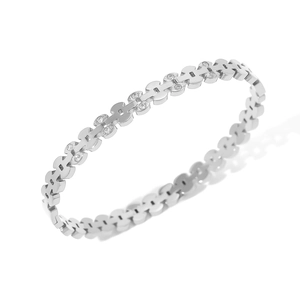 Macro detail of geometric link bracelet with silver plating and sparkling crystal accents