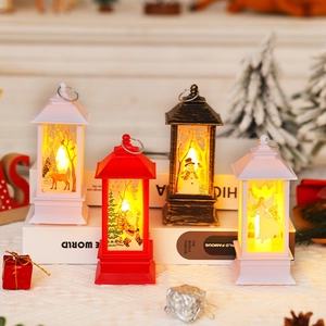 Cozy Christmas LED lantern scene with Santa and reindeer motifs in warm yellow light