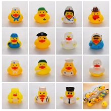 Macro display of sixteen assorted rubber ducks with various professional character designs