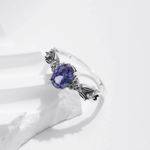 Vintage S925 sterling silver ring with oval purple gemstone and mermaid tail design