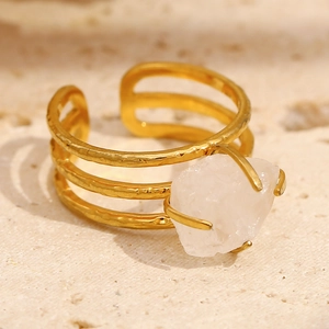 Close-up of three-layer 18K gold plated ring with a natural white raw crystal stone