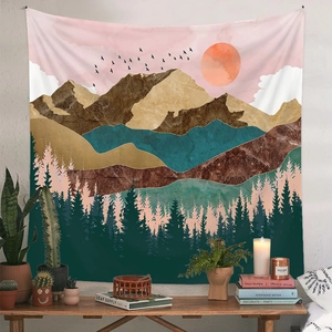 Detailed view of bohemian tapestry with pink sunset, mountain landscape and forest design
