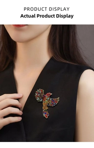 Detailed view of colorful rhinestone hummingbird brooch on a black blazer lapel