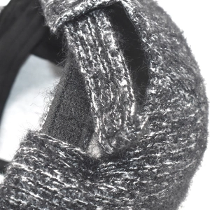 Detail of adjustable Velcro strap and wool blend fabric on a grey baseball cap