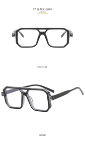 Detail view of black and gray oversized pilot frame glasses showing front and side profile