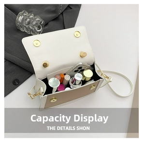 Macro detail of spacious interior in contrast-color crossbody bag with daily essentials