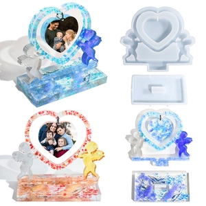 Detail of Cupid heart frame silicone mold with finished resin flower photo frames