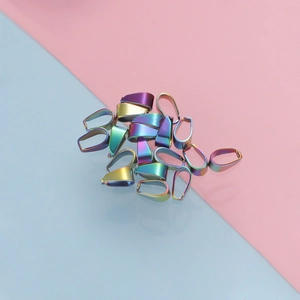 Detailed macro view of rainbow iridescent stainless steel pendant clasps for DIY jewelry