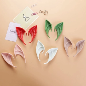 Flat lay of colorful latex elf ears for Halloween cosplay in various bright pastel colors