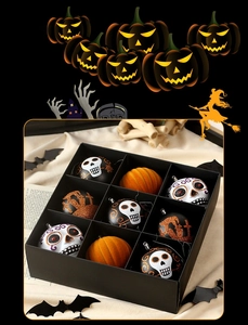Set of nine Halloween decorative balls featuring skull and pumpkin designs in a black gift box