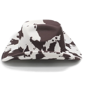 Detailed top view of a western cowboy hat with a brown and white cow print wool pattern