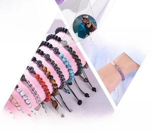 Detailed view of handmade rose quartz projection bracelet with adjustable braided natural stones