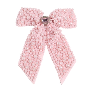 Pink oversized ribbon bow hair clip with faux pearls and sparkling pink gemstone center