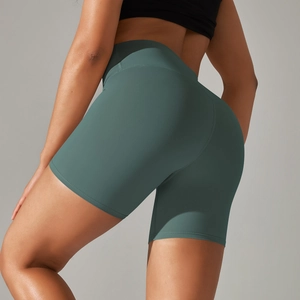 Detail of high waisted teal yoga shorts with double sided brushed texture and push up effect