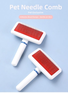 Detail of pet slicker brush with protective beads on pins to protect animal skin
