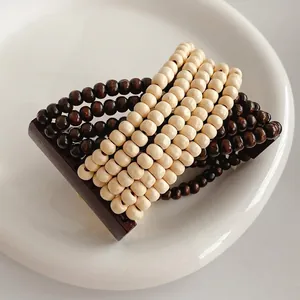 Bohemian multi-layer coconut shell wood bead stretch bracelet in dark brown and off-white
