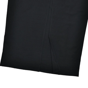 Detail view of the side slit design on a black knitted slim fit dress
