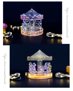 Detail of carousel resin mold ornaments with pink and gold glitter under warm LED lights