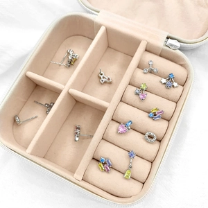 Portable jewelry box featuring multi-slot storage for various colored zircon stud earrings