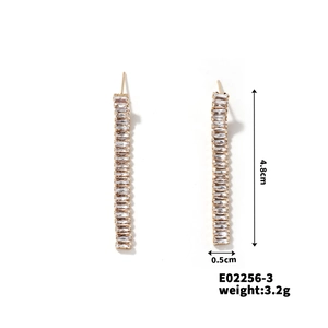 Detail view of gold-plated drop earrings with clear zircons, size 4.8cm by 0.5cm