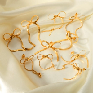 Elegant 18k gold plated stainless steel bow earrings featuring snake chain textures