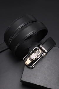 Detail of black leather belt with lychee texture, automatic buckle and premium gift box